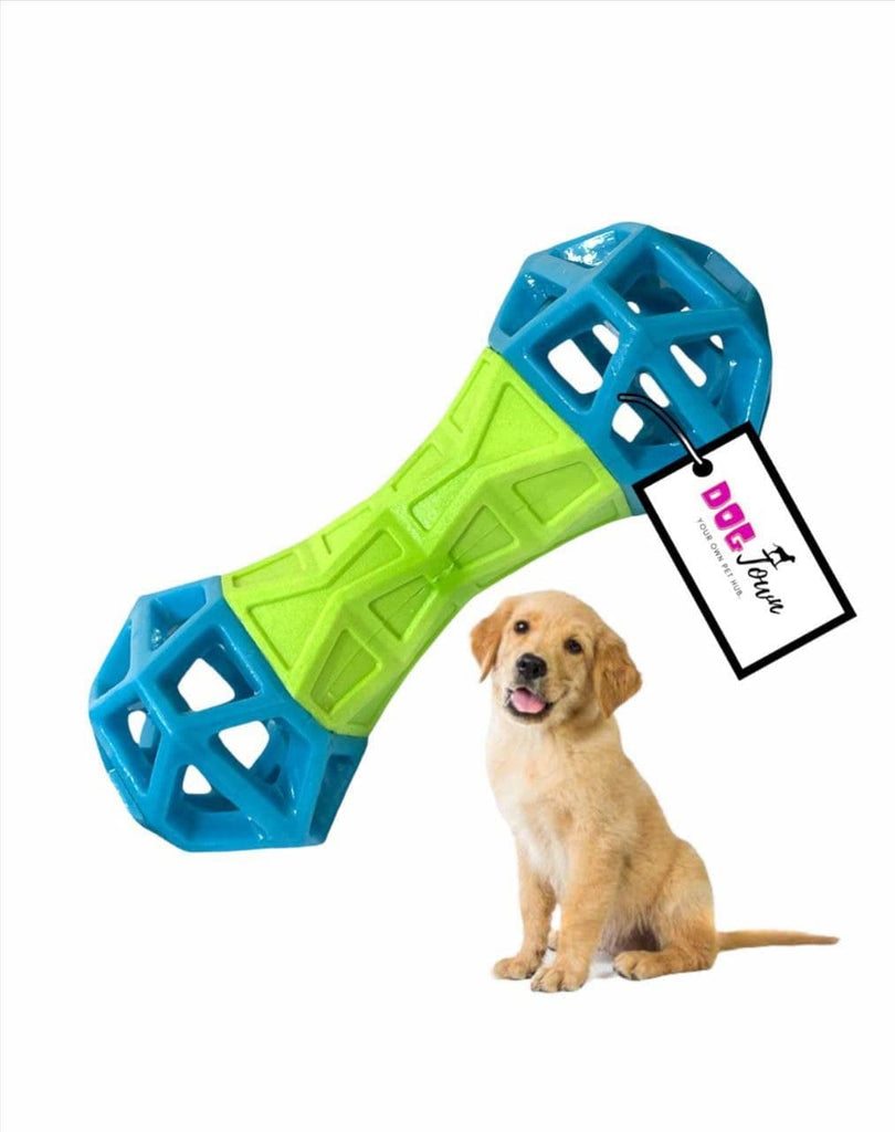 Dog toy with blue and green design and a puppy sitting next to it on a white background