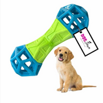 Dog toy with blue and green design and a puppy sitting next to it on a white background