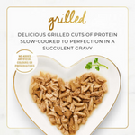 Heart-shaped plate with grilled protein pieces and text about slow-cooked protein dishes.