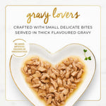 Heart-shaped plate with food and 'gravy lovers' text on a white background