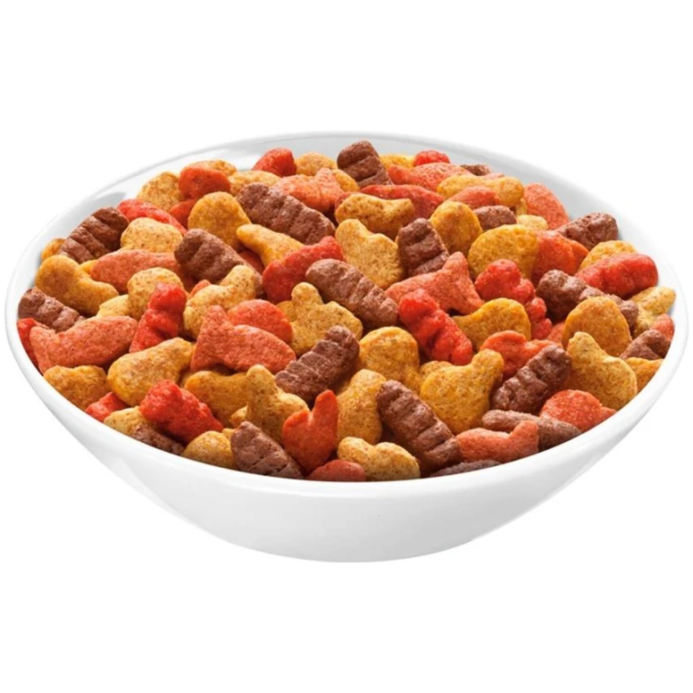 Assorted colored pet treats in a white bowl on a white background