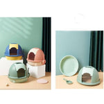 Colorful pet litter boxes on a light green background