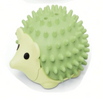 Green hedgehog-shaped toy with spiky texture on a white background