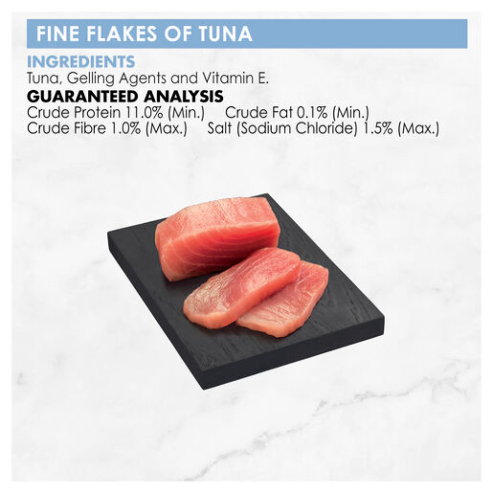 Fine flakes of tuna on a black square plate with ingredient and guaranteed analysis information.