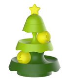 Green and yellow toy tree with two balls on a white background