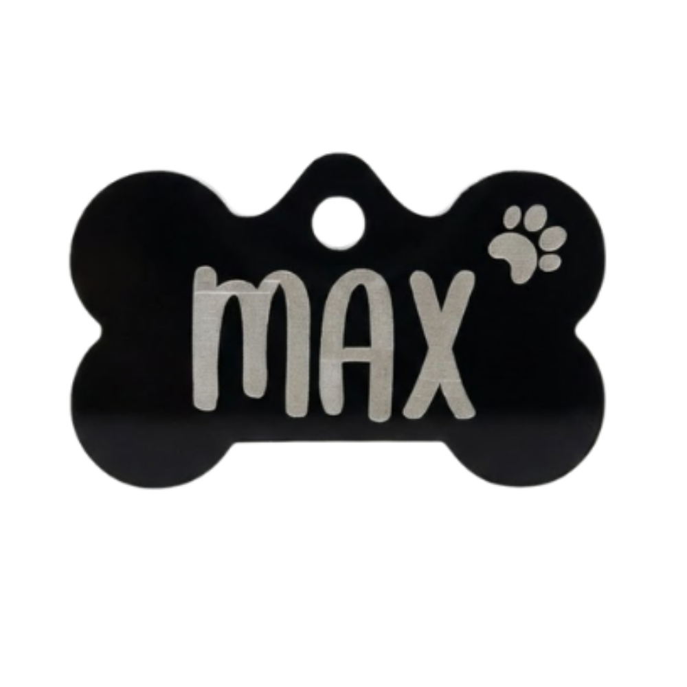 Black bone-shaped pet tag with 'max' and a paw print on a white background