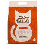 Bag of Ramlah cat litter with a white cat illustration on an orange background