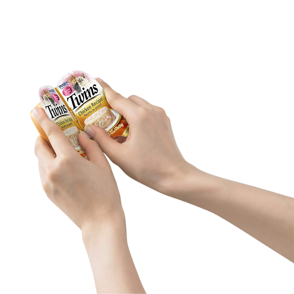 Hands holding a box of Twinkies on a white background