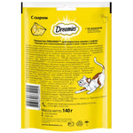 Yellow package of Dreamies cat treats with text and a cat illustration on a white background