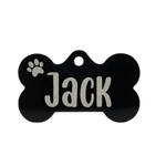 Black bone-shaped pet tag with 'Jack' engraved on a white background