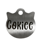 Metallic pet tag with 'Cokie' engraved on a white background