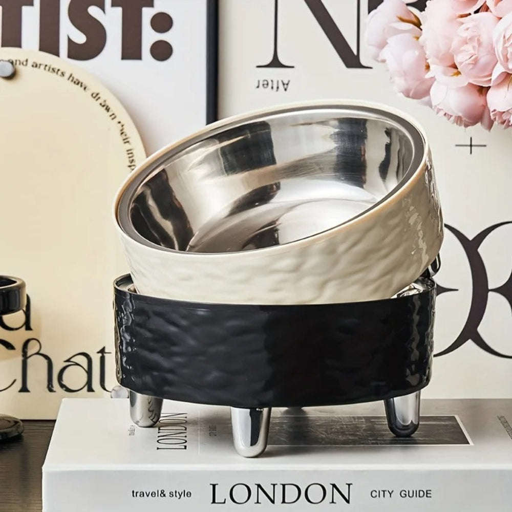 Decorative metal bowl with black base on a magazine with 'London' text
