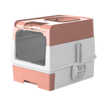 Pet litter box with pink top and base on a white background