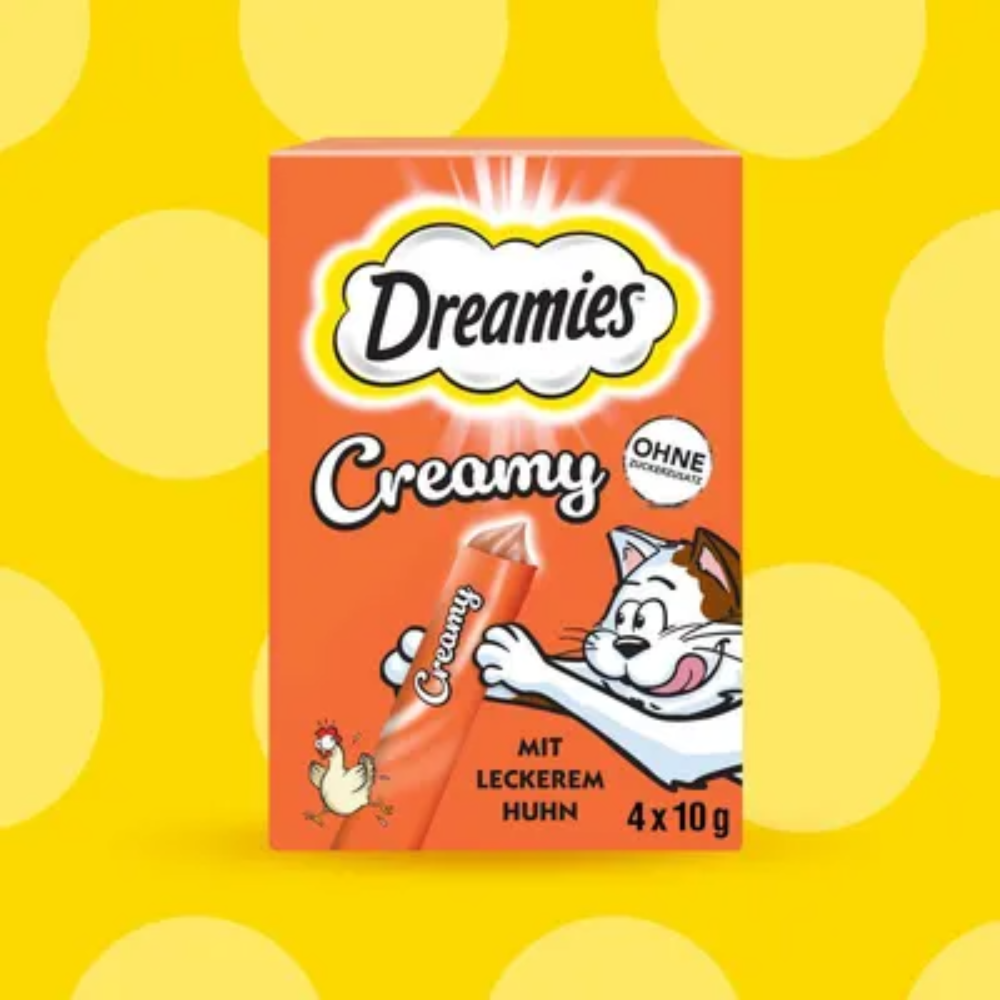 Dreamies Creamy cat food packaging on a yellow background