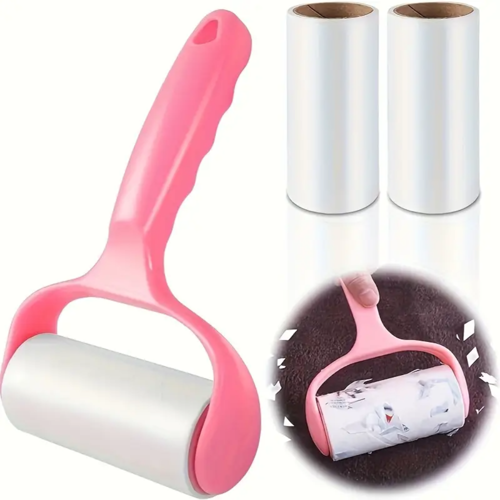 Pink and white pet hair removal roller with two replacement rollers on a white background.