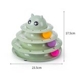 Three-tiered green toy with colorful balls and measurements on a white background