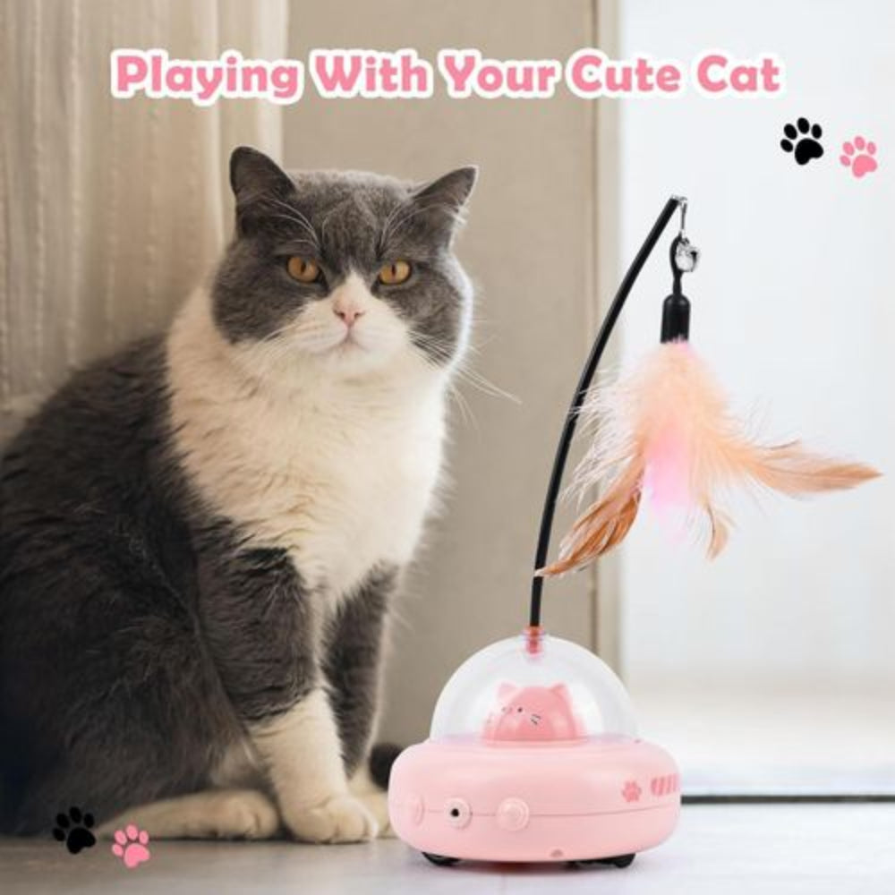 Cat playing with a pink toy featuring a feather and light
