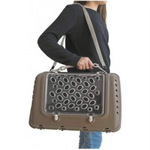Person holding a pet carrier with a clear front panel