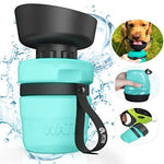 Portable dog water bottle with black cap and handle, surrounded by water droplets and a dog drinking from it.
