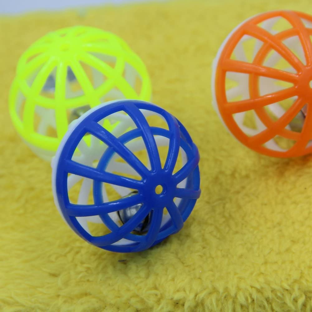 Three colorful mesh balls on a yellow textured surface