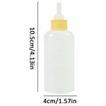 White dropper bottle with yellow cap on a white background, showing dimensions.