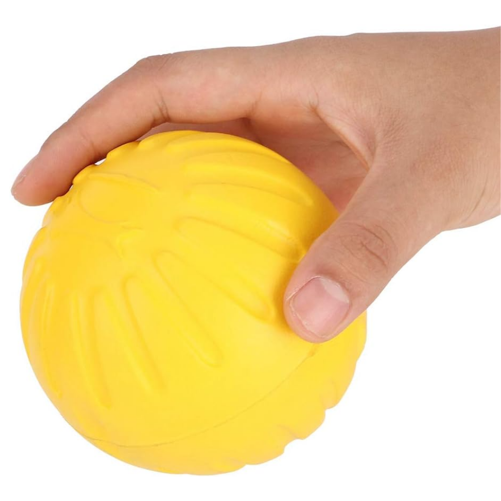 Hand holding a yellow textured ball against a white background