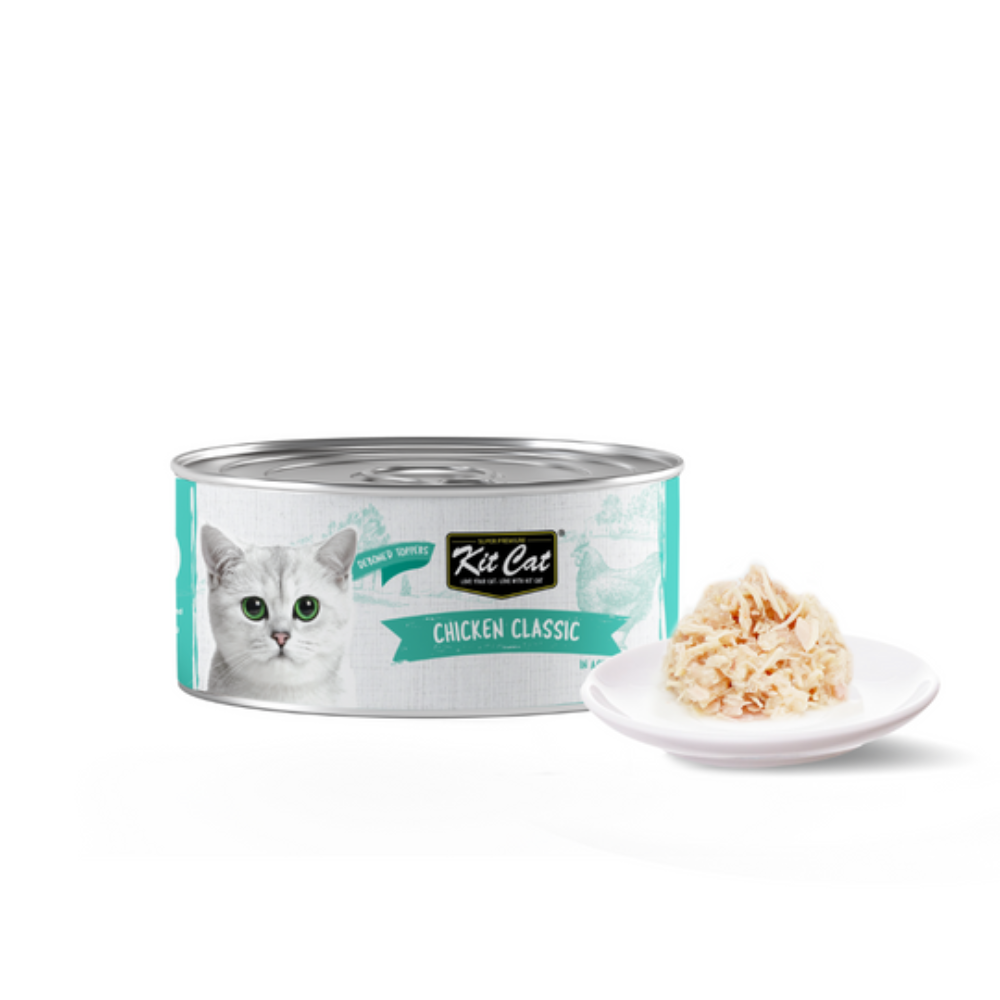 Can of Kit Cat Chicken Classic cat food with a small plate of food on a white background