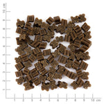 Pile of brown dog treats on a white background with measurement scale