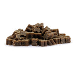 Stack of brown dog treats on a white background