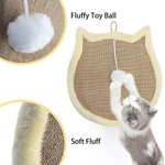 Cat playing with a fluffy toy ball attached to a scratching pad.