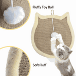 Cat playing with a fluffy toy ball attached to a scratching pad.
