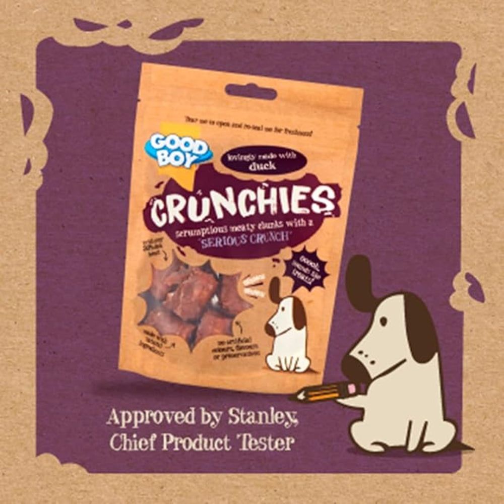 Good Boy Crunchies dog treat package on a brown and purple background with a cartoon dog.
