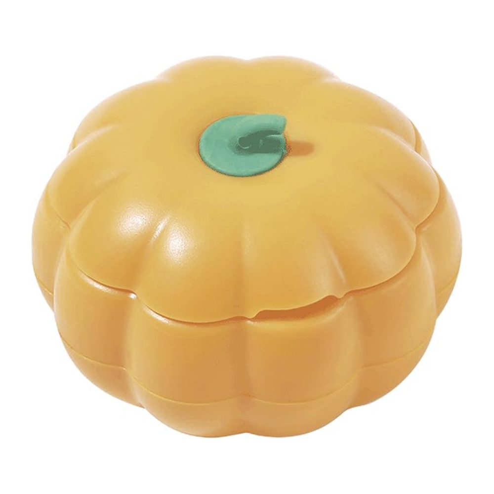 Yellow pumpkin-shaped container with a green leaf on a white background