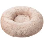 Fluffy pink donut pet bed on a white background