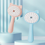 Pink and blue handheld scrubbers with cat ear designs on a light blue background