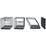 Set of metal pet crates in various stages of assembly.
