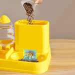 Yellow pet feeder with a water bottle on a wooden surface