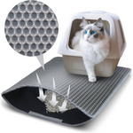 Cat litter mat with textured pattern and a cat peeking out from a litter box.