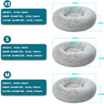 Gray donut pet bed with size chart showing height, inner diameter, and outer diameter measurements.