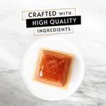 Square of amber-colored soap on a white plate with 'Crafted with High Quality Ingredients' text above.
