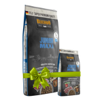 Two bags of Bélcan O Junior Maxi dog food with a green bow on a white background