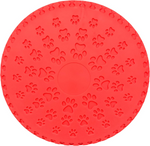 Red circular mat with paw print pattern on a white background