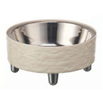 Stainless steel bowl with beige ceramic base on a white background