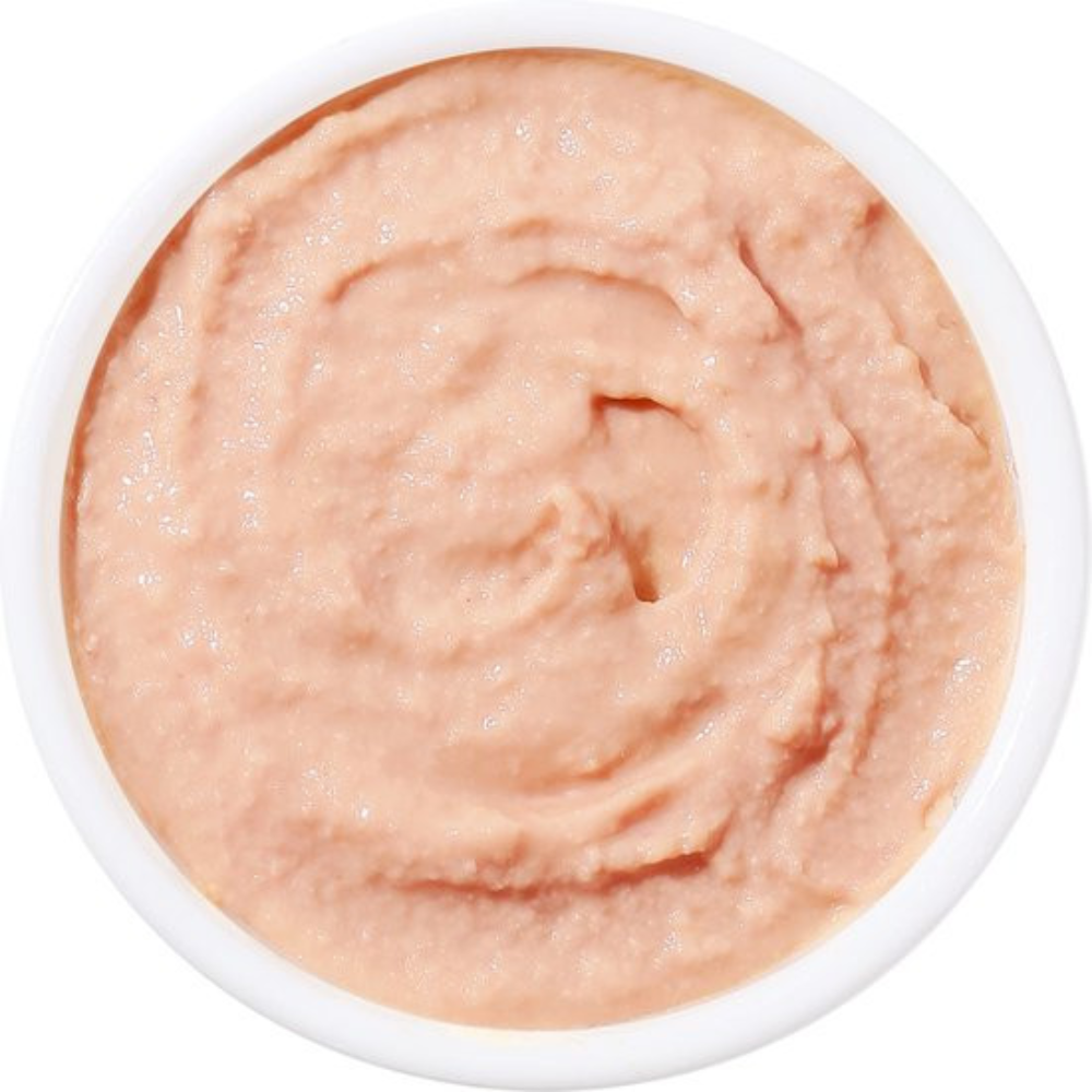 Pinkish-beige cream in a white container on a white background