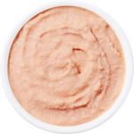 Pinkish-beige cream in a white container on a white background