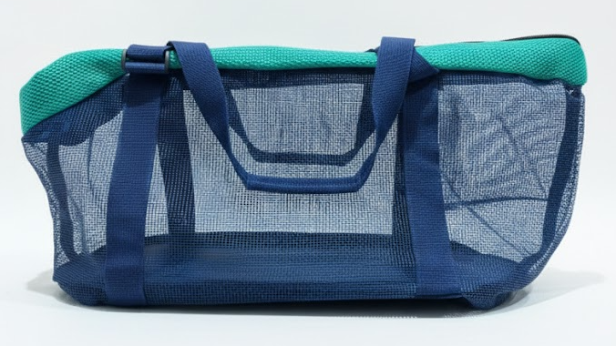 Blue and green pet carrier on a white background