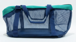 Blue and green pet carrier on a white background