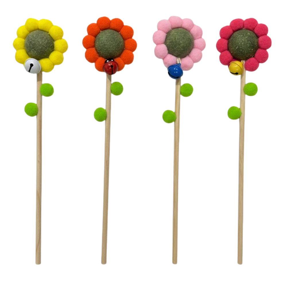 Four colorful flower-shaped lollipops on sticks with small toys inside against a white background.