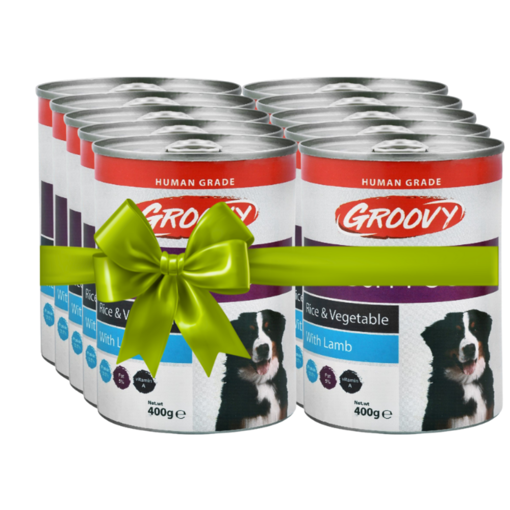 Multiple cans of Groovy dog food with a green bow on a white background
