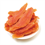 Dried orange slices on a white plate with a white background